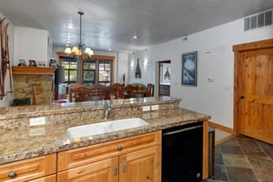 The wellequipped kitchen offers a breakfast bar with seating for 2.