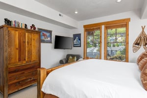 The main suite offers a king size bed, comfortable sitting area, and flat screen TV.
