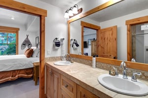 The main suite offers an en suite bathroom with two sink vanity.