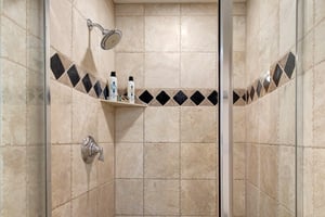 The en suite bathroom offers a walkin shower.