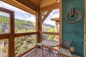 Town Pointe C302 has a private deck with a sitting area to enjoy a beverage.