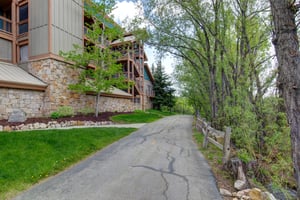 Town Pointe Condominiums has a lovely walkway lined with trees.