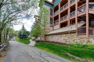 Town Pointe Condominiums has a lovely walkway lined with trees.