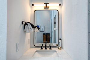 The attached bathroom with single sink vanity.