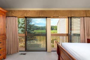 The main suite has beautiful views of the golf course and pond.