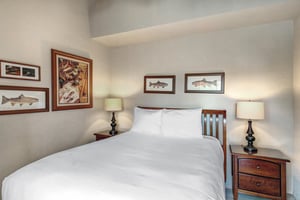 The second bedroom has a queen size bed and well appointed furniture.