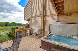 The private hot tub and private outdoor deck.