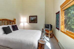 The second bedroom with a queen bed.