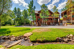 Timber Wolf Lodge 7C is surrounded by plants, trees and a babbling creek nearby.