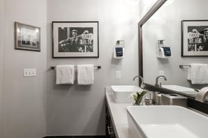 The shared bathroom with double sink vanities.