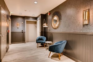 The entryway to the condo with seating for two.