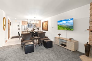 The open concept kitchen, dining room, and living room.