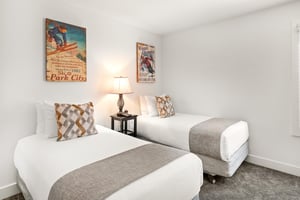 The second bedroom has two twin beds.