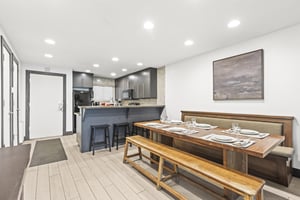 Snow Flower 126 has a dining area with seating for 8 guests.