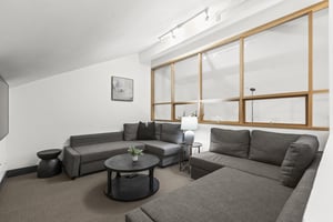 The loft has a spacious seating area with two sectional sofas.