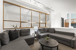 The loft has a spacious seating area with two sectional sofas.