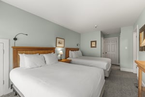 The second bedroom with two queen beds.