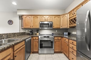 The wellequipped kitchen with new stainless steel appliances.