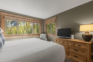 The main suite has a kingsize bed and a flat screen TV.