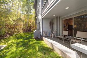 The private patio with 4 chairs and overlooking the aspen grove.