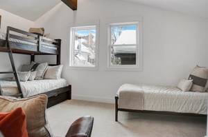 The third bedroom with a twin over full bunk bed with a twin trundle and a twin bed.