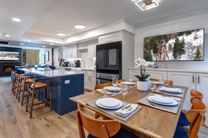 The open concept dining room with a flat screen TV.