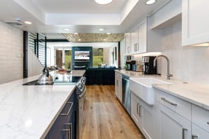The spacious galley kitchen in the middle of the open concept living area.