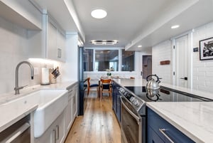 The spacious galley kitchen in the middle of the open concept living area.