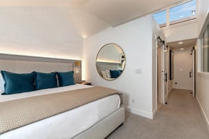 The spacious main suite with a kingsize bed.