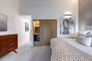 The second main suite with a well organized built in closet system.
