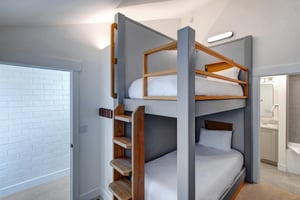 The third bedroom with a custom built in twin bunk bed.