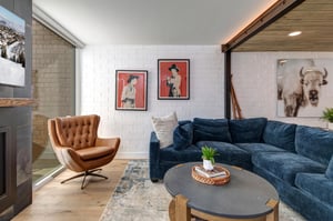 Ski Captain Molly offers a blue sectional sofa, leather chair, and western art on the walls.