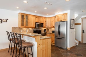 Snow Flower 74 offers stainless steel appliances in the open concept kitchen.