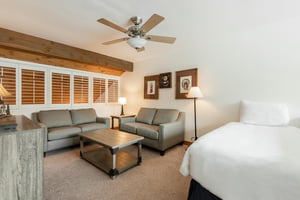 The loft with sitting area and a twin bed.