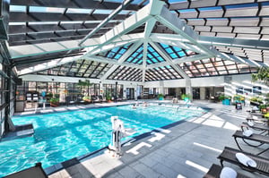 Indoor pool atrium at the indooroutdoor pool with stunning skylights