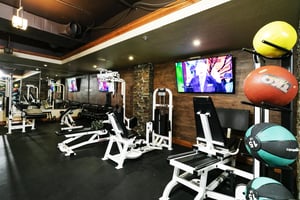 Fitness center weight rack and weight machines with wall mounted TV