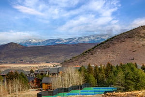 Stunning mountain landscape surrounds this scenic Utah valley location with snowcapped peaks and rolling hills.