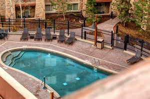 Take a refreshing dip in the sparkling outdoor pool, surrounded by comfortable lounge chairs.