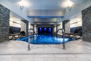 Adult relaxation pool, indoor pol sapphire blue lighting