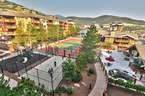 Aerial view of tennis courts, playground, and basketball court