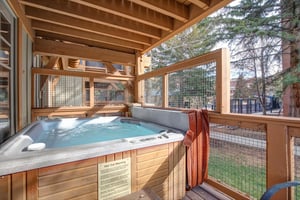 Soak away your cares in your private hot tub on this covered wooden deck, complete with towels and peaceful treelined views.