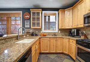 Your fully equipped kitchen features granite countertops, warm wood cabinetry, and all the appliances you need to prepare delicious meals.