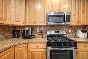 Your fully equipped kitchen features granite countertops, stainless steel appliances, and everything you need to prepare meals.