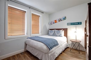 Your cozy bedroom features unique local touches like vintage ski memorabilia.