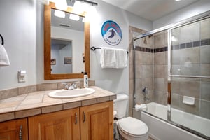 Unwind in your spacious bathroom featuring a relaxing showertub combo.