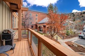 Step out onto your private wooden balcony and take in the colorful autumn scenery of this charming mountain town.