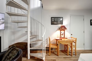 Your cozy retreat features a charming spiral staircase and intimate dining nook, perfect for enjoying morning coffee or planning your Park City adventures.