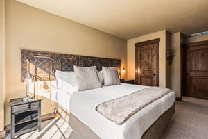 The main suite bedroom with a king size bed.