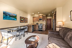 The open concept living area with efficient kitchen.