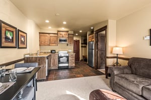 The open concept living area with efficient kitchen.
